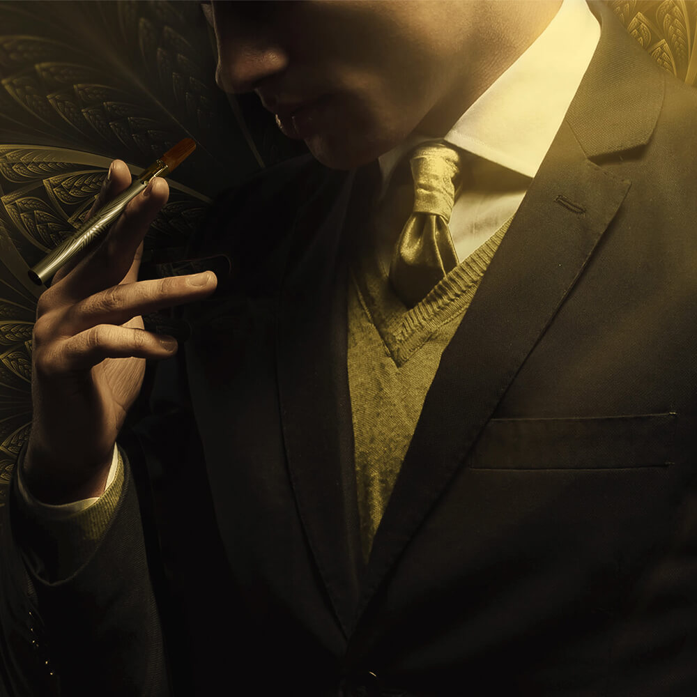 Man dressed in tuxedo with golden tie holding MISTIFI Premium Cannabis Vape Pen