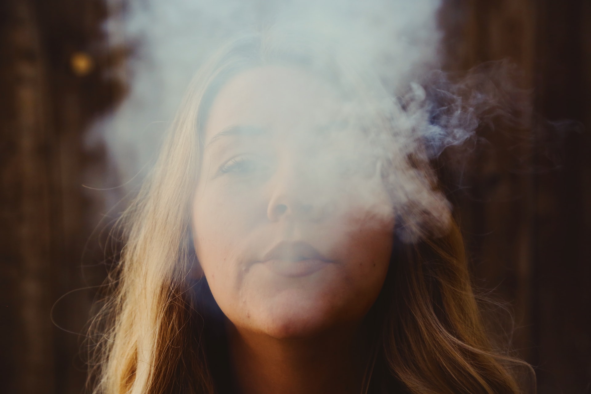 woman smoking cannabis vape made with solventless extraction